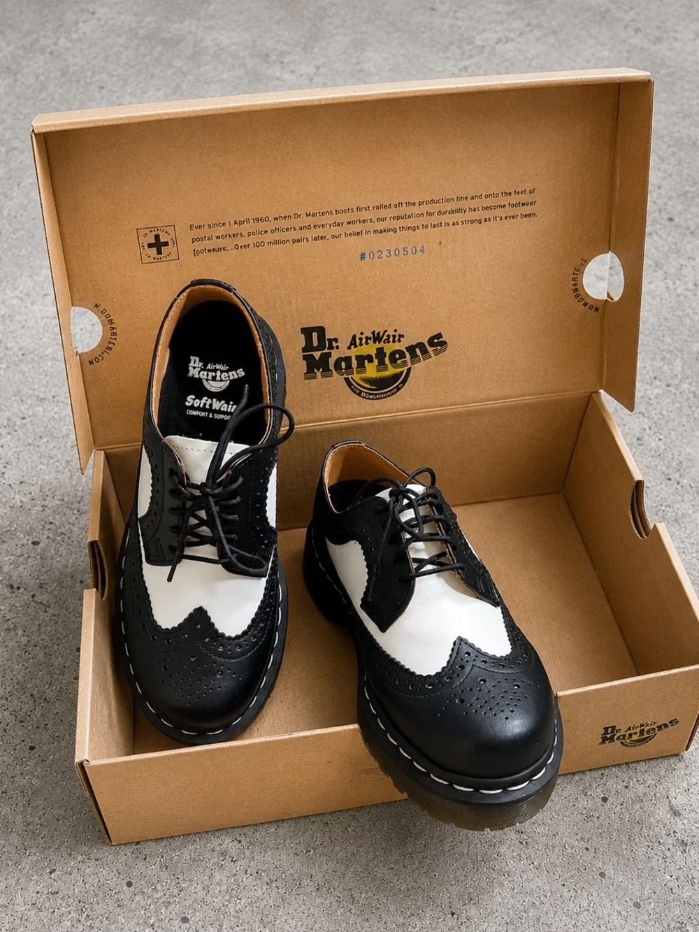 Dr. Martens Black & White Brogue Saddle Oxfords